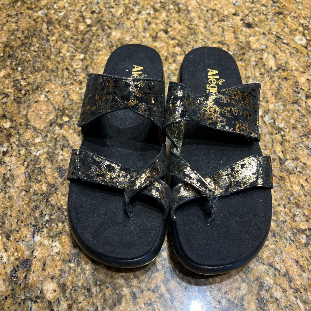 Alegria Black and Gold Slide Sandals